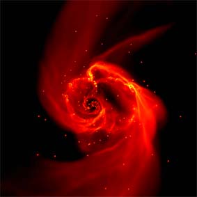 Ein dichter Sternhaufen entsteht im Innern einer kollabierenden Gaswolke (Computersimulation ZAH/ITA, Clark et al. 2008).